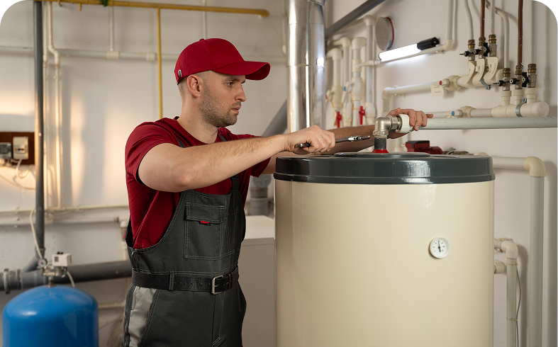 Technician fixing a water heater tank.
